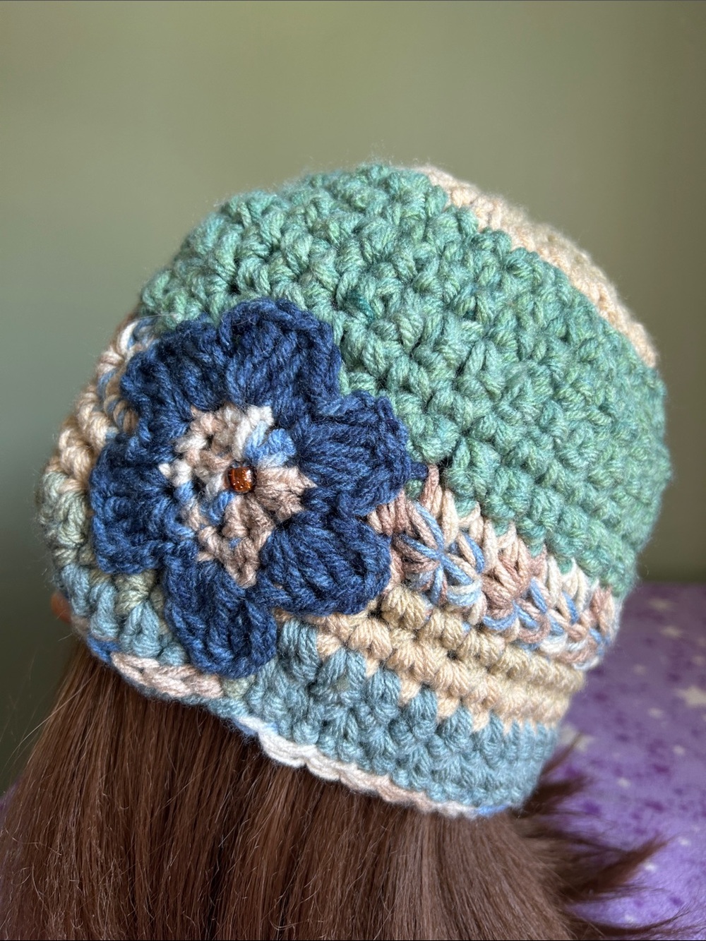 Handmade Crochet Beanie with Blue Flower Accent - Multicolor medium acrylic